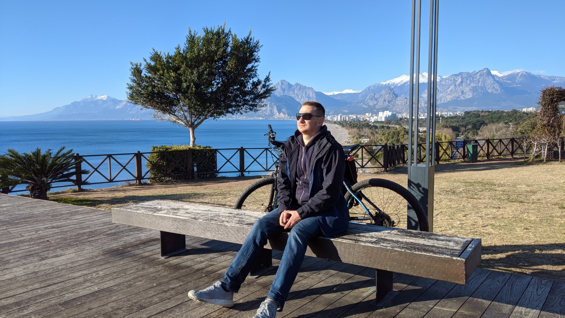 My photo with the sea and mountains in the background
